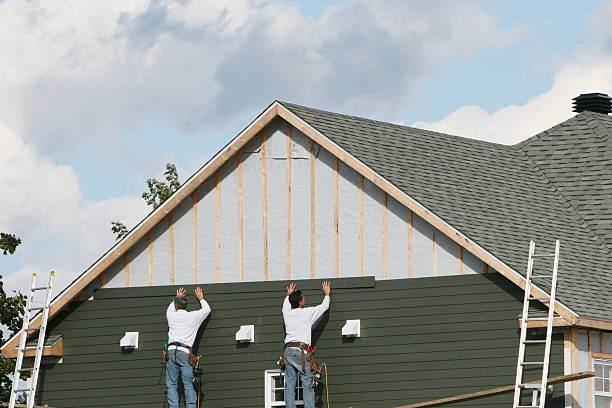 Professional Siding Contractor technician working in Bellville, TX
